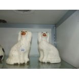 A pair of medium Staffordshire mantle Dogs.