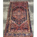 A vintage hand-made Mahal Rug, circa 1920. 216cm x 122cm.