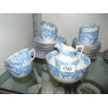 A china Teaset, white with a blue flower border and gold fluted edge, six cups, twelve saucers,