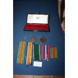 A military badge for Royal Engineers, campaign medal ribbons,