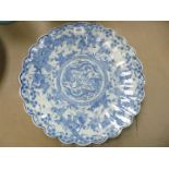 A large blue and white oriental Dish, having scalloped edge,