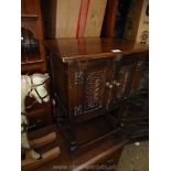 A reproduction Oak Cabinet,