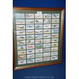 A framed set of fifty 'International Air Liners' cigarette Cards by John Player & Sons.