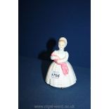 A Royal Doulton 'The Rag Doll' figure, HN 2142 copyright 1953.