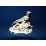 A Crown Staffordshire ''Golden Pheasants'' modelled by J.T. Jones, signed by W.R.