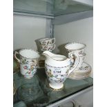 A quantity of Jackson and Gosling Grosvenor china comprising of five cups, four saucers, milk jug,