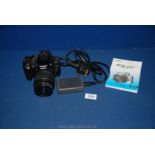 A Canon EOS 350D digital Camera with instructions and charger