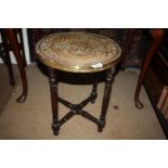 An eastern Brass topped circular Occasional Table, 15'' diameter, 17'' wide approx.