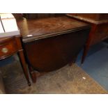 A dark Oak finished gateleg drop-leaf Dining Table,