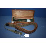 A gun belt and gun cleaning kit.