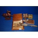 A box of miscellaneous Treen, Trojan horse, black doll, autograph book, boxes etc.