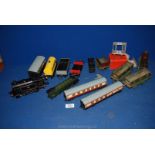 A box of vintage trains to include; Silver King carriages, British railways, etc.