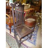 An early peg-joyned framed dark Oak Hall Chair having a solid seat,