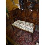 An attractive Edwardian mixed woods double Seat having lightwood stringing ,