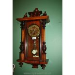 A small Vienna type Wall Clock with brass face