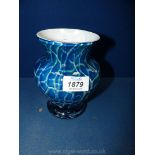 A Dartington Studio heavy glass vase in blue crazed effect with lime and white infill's,