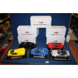 Five boxed Maisto Super Cars including Porsche 911, Ferrari 348ts, Bugatti,