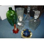 A quantity of mixed glass including blue paperweight, orange perfume bottle, three decanters,