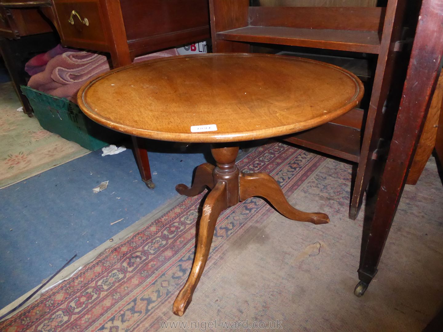 A turned Mahogany topped Occasional Table on turned pillar with three splay feet,