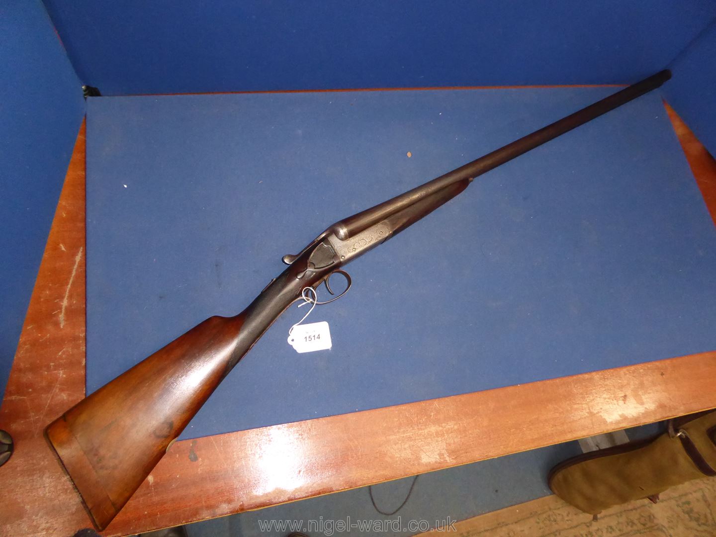 An antique 12 bore side by side double trigger,