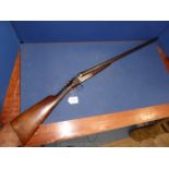 An antique 12 bore side by side double trigger,