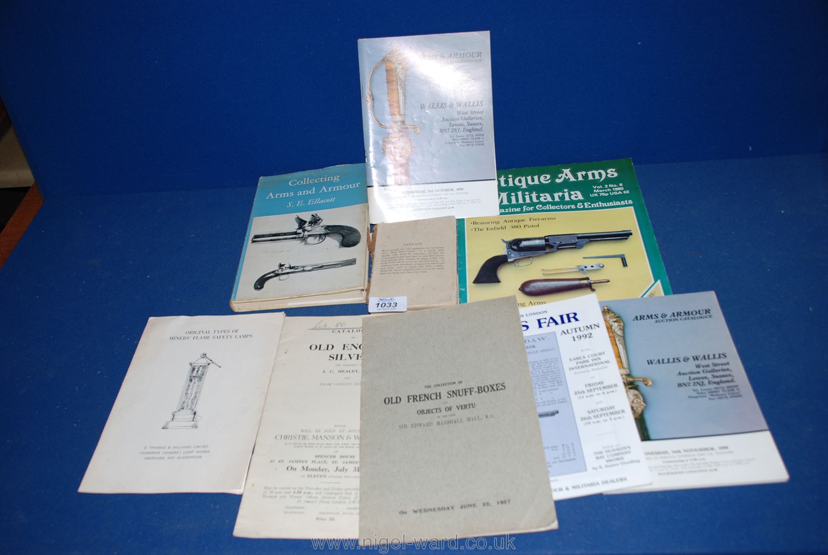A box containing old auction catalogues,