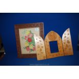Two carved wooden frames.