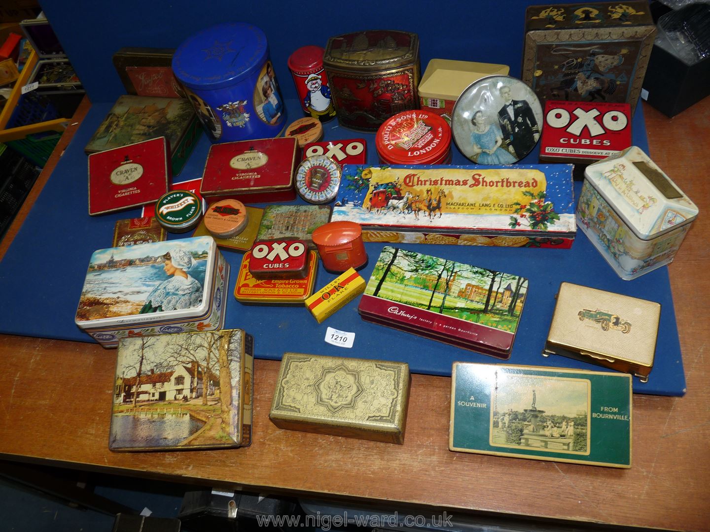 A quantity of vintage tins including Oxo, Players Navy Cut, Post Office Savings money box.
