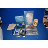 A box of miscellaneous military items including uniform badges ''Target:Germany'' book,