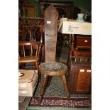 A darkwood Arts and Crafts type spinning chair having a circular seat depicting the Welsh Dragon