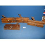 Four old woodworking Planes