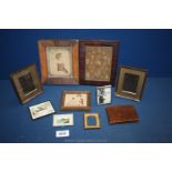 A small box of old miniature pictures, embroideries, tapestry picture of a little girl etc.