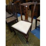 An elegant mixed woods Georgian Nursing Chair having interesting top rail and raised on cabriole