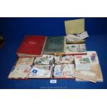 A red Triumph Stamp Album with many old English and foreign stamps together with a Stanley Gibbons