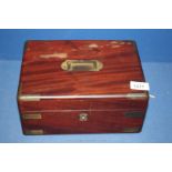 A Mahogany writing slope with brass handle and corners,