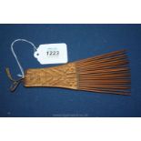 A collectible antique Congolese wooden hair comb with woven rattan handle, excellent patination,