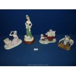 A tray of china figures, lady having a picnic, boy with horse,