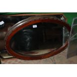An oval bevel plate Mirror with wooden surround, a/f.
