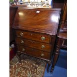 A Mahogany Bureau having light and darkwood stringing,