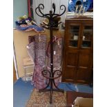 A dark stained Bentwood Hat and Coat Stand, for standing against a wall,