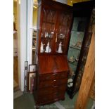 A cross banded Mahogany reproduction Bureau/Bookcase,