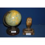 A Chad valley tin plate toy globe and a vintage plaster owl paperweight.