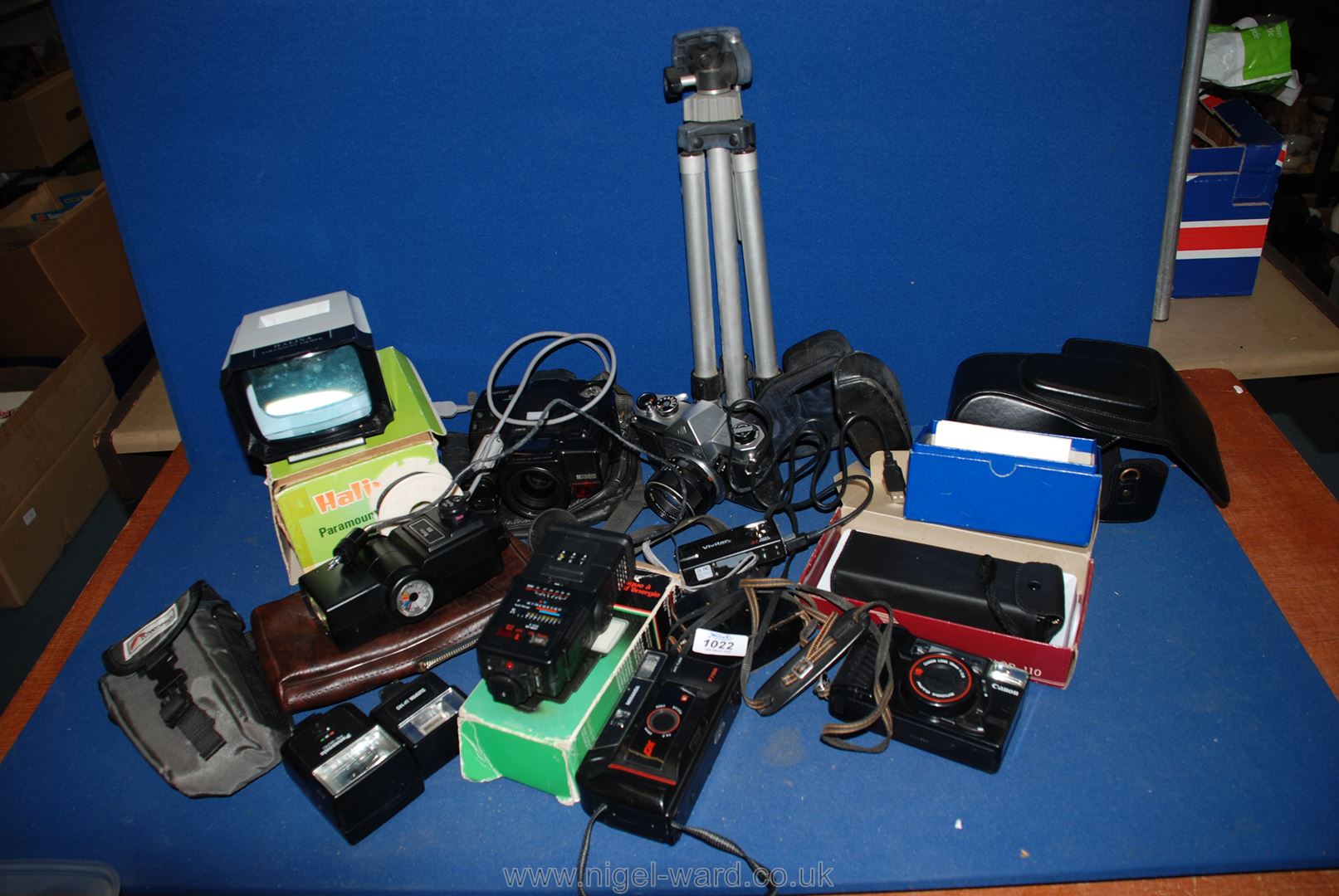 A box of Cameras to include Paramount viewer, Canon, flash meter, pocket camera, Pentax, tripod,