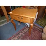 A pair of contemporary light Oak Side Tables standing on cabriole legs and each having a frieze