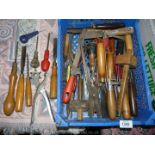 A tray of tools including woodworking chisels, saws, hammers, hole maker, Stanley knife, etc.
