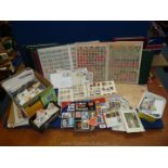 A box containing 10,000 plus stamps in two large stockbooks (3,100 stamps), on album pages,