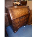 A 1940/50's Oak Bureau having a pigeon hole interior with a drawer,