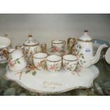 A dainty tea service including; a teapot, hot water jug, milk jug,