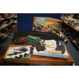 A Scalectric set, boxed 'Grand Prix 50' and a box of Scalextric additional track, markers etc.