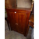 A reproduction darkwood floor standing double doored Cupboard,